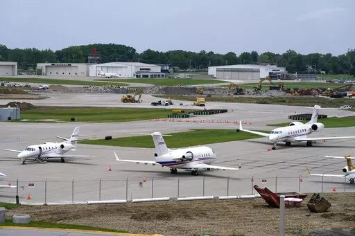 Planes sit on the tarmac at the Des Moines International Airport, Monday, June 13, 2022, in Des Moines, Iowa. With an eye on the upcoming July Fourth weekend, airlines are stepping up their criticism of federal officials over recent widespread flight delays and cancellations. The industry trade group Airlines for America said Friday, June 24, 2022, that understaffing at the Federal Aviation Administration is crippling traffic along the East Coast. (AP Photo/Charlie Neibergall, File)