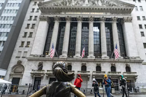The Fearless Girl statue stands outside of the New York Stock Exchange is shown on Friday, Jan. 19, 2024, in New York. Wall Street is rising Friday and may break past its all-time high set two years ago, before the highest inflation and interest rates in decades sent financial markets tanking worldwide. (AP Photo/Peter K. Afriyie)