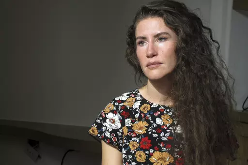 Chelsea Goodrich poses for a portrait at a friend's house in Ketchum, Idaho, on Tuesday, Sept. 19, 2023. Goodrich's father, a popular Idaho dentist and former bishop in The Church of Jesus Christ of Latter-day Saints, widely known as the Mormon church, was excommunicated after sharing details about his relationship with her when she was a child during a religious confession. Recordings obtained by The Associated Press show that instead of helping prosecutors, the church used a legal playbook tha