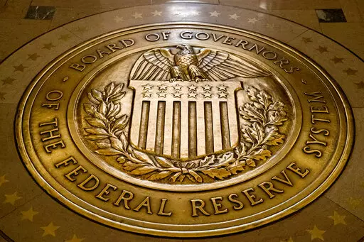 FILE- In this Feb. 5, 2018, file photo, the seal of the Board of Governors of the United States Federal Reserve System is displayed in the ground at the Marriner S. Eccles Federal Reserve Board Building in Washington. As the Federal Reserve continues to increase interest rates, borrowers may find that they’re paying more for their debts or perhaps missing out on opportunities to boost their savings with better rates. (AP Photo/Andrew Harnik, File)