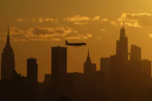A plane flies with the New York City skyline, Thursday, Sept. 8, 2022, in New York. The ground rumbled Friday, April 5, 2024, beneath New York City, home to famous skyscrapers like the Empire State Building and One World Trade Center. Though buildings that can reach above 100 stories might seem especially vulnerable to earthquakes, engineering experts say they're built with enough flexibility to withstand them. (AP Photo/Julia Nikhinson, File)