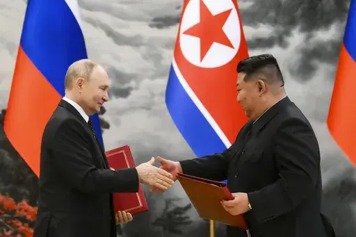 Russian President Vladimir Putin, left, and North Korea's leader Kim Jong Un exchange documents during a signing ceremony of the new partnership in Pyongyang, North Korea, on June 19, 2024. (Kristina Kormilitsyna, Sputnik, Kremlin Pool Photo via AP, File)