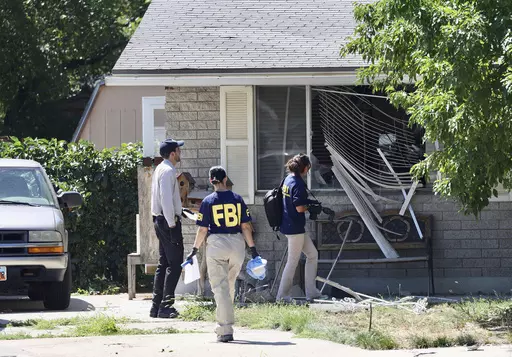 Law enforcement investigate the scene of a shooting involving the FBI, Aug. 9, 2023 in Provo, Utah. This week's confrontation that ended with FBI agents fatally shooting a 74-year-old Utah man who threatened to assassinate President Joe Biden was just the latest example of how violent rhetoric has created a more perilous political environment across the U.S. (Laura Seitz/The Deseret News via AP, File)