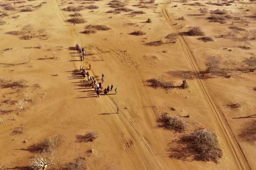People arrive at a displacement camp on the outskirts of Dollow, Somalia, Sept. 21, 2022 amid a drought. A new report says an estimated 43,000 people died amid the longest drought on record in Somalia last year and half of them likely were children. (AP Photo/Jerome Delay, File)