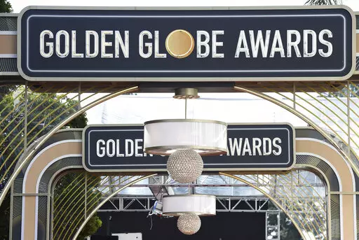 Event signage appears above the red carpet at the 77th annual Golden Globe Awards on Jan. 5, 2020, in Beverly Hills, Calif. The 80th annual Golden Globe Awards will take place on Tuesday, Jan. 10. (Photo by Jordan Strauss/Invision/AP, File)