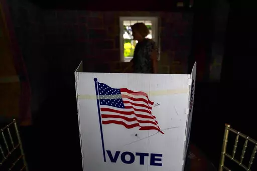 A person waits in line to vote in the Georgia's primary election on May 24, 2022, in Atlanta. A new poll shows 71% of voters think the future of the country is at stake when they vote in November's midterm elections. That's according to a new poll from The Associated Press-NORC Center for Public Affairs Research. (AP Photo/Brynn Anderson, File)