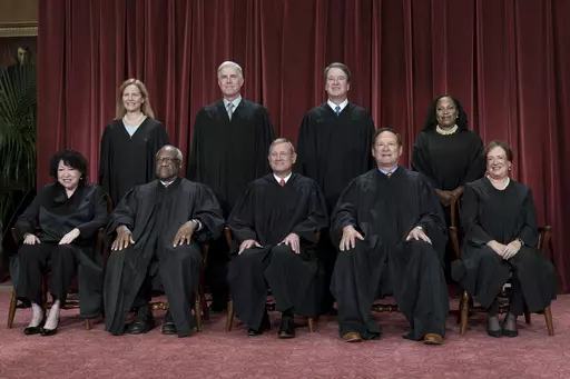 Members of the Supreme Court sit for a new group portrait following the addition of Associate Justice Ketanji Brown Jackson, at the Supreme Court building in Washington, on Oct. 7, 2022. Bottom row, from left, Associate Justice Sonia Sotomayor, Associate Justice Clarence Thomas, Chief Justice of the United States John Roberts, Associate Justice Samuel Alito, and Associate Justice Elena Kagan. Top row, from left, Associate Justice Amy Coney Barrett, Associate Justice Neil Gorsuch, Associate Justi