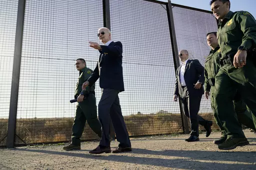 President Joe Biden walks along a stretch of the U.S.-Mexico border in El Paso Texas, Jan. 8, 2023. The Biden administration has requested 1,500 troops for the U.S.-Mexico border amid an expected migrant surge following the end of pandemic-era restrictions. (AP Photo/Andrew Harnik, File)