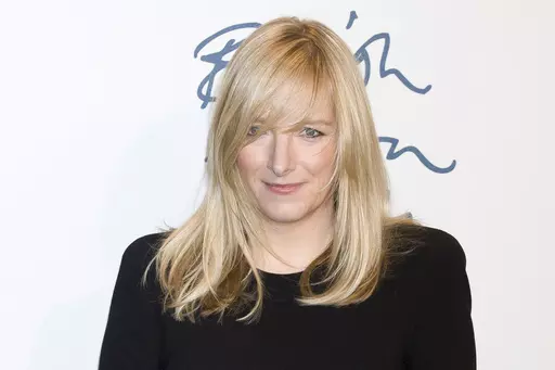 Sarah Burton arrives for the British Fashion Awards 2011 at a central London venue, on Nov. 28, 2011. The fashion designer who created the wedding dress of Kate, the Princess of Wales, is stepping down as creative director at Alexander McQueen after two decades at the brand, luxury group Kering said Monday Sept. 11, 2023. (AP Photo/Jonathan Short, File)