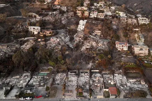 Destroyed homes from the Palisades Fire are visible on Jan. 15, 2025, in Malibu, Calif. (AP Photo/Jae C. Hong, File)