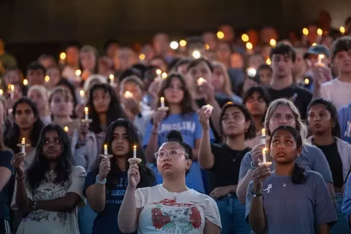 University of North Carolina-Chapel Hill students, faculty and family hold a candlelight vigil, Aug 30, 2023, in Chapel Hill, N.C., in honor of professor Zijie Yan, who was shot and killed on campus earlier that week. Two shooting 30 years apart at the University of North Carolina show how much has changed. Some alumni who remember a deadly shooting in 1995 now have children enrolled at their alma mater in Chapel Hill, where an associate professor was shot to death Aug. 28. In some ways, the era
