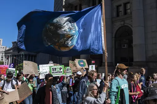 Activists gather and walk through lower Manhattan for the Global Climate Strike protests, Sept. 23, 2022, in New York. The annual Climate Week, which coincides with the U.N. General Assembly, kicks off Sunday, Sept. 17, 2023, with tens of thousands of people expected in the “March to End Fossil Fuels” Manhattan rally, one of hundreds of worldwide protests. (AP Photo/Brittainy Newman, File)