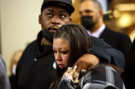 Daunte Wright's parents, Aubrey Wright and Katie Wright, who also sometimes uses the name Katie Bryant, react after former Brooklyn Center Police Officer Kim Potter was sentenced to two years in prison, Friday, Feb. 18, 2022 in Minneapolis. Potter was convicted in December of both first-degree and second-degree manslaughter in the April 11 killing of Wright, a 20-year-old Black motorist. (AP Photo/Nicole Neri )