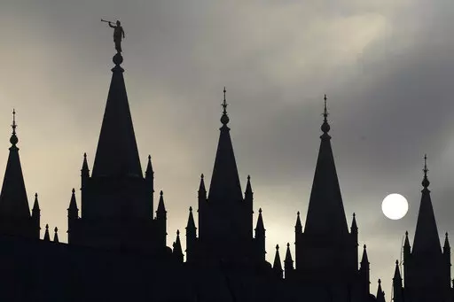 The angel Moroni statue atop the Salt Lake Temple is silhouetted against a cloud-covered sky, at Temple Square in Salt Lake City on Feb. 6, 2013. The U.S. Securities and Exchange Commission says, Tuesday, Feb. 21, 2023, The Church of Jesus Christ of Latter-day Saints and its investment arm will pay $5 million in fines. The SEC alleges the church used shell companies to obscure the size of the portfolio under the church's control.(AP Photo/Rick Bowmer, File)
