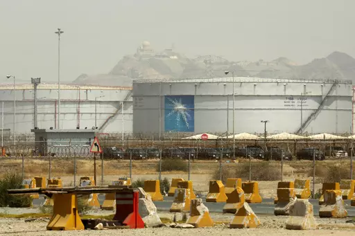 Storage tanks are seen at the North Jiddah bulk plant, an Aramco oil facility, in Jiddah, Saudi Arabia, on March 21, 2021. Saudi oil giant Aramco reported Sunday, March 10, 2024 a $121 billion profit last year, down from its 2022 record due to lower energy prices. (AP Photo/Amr Nabil, File)