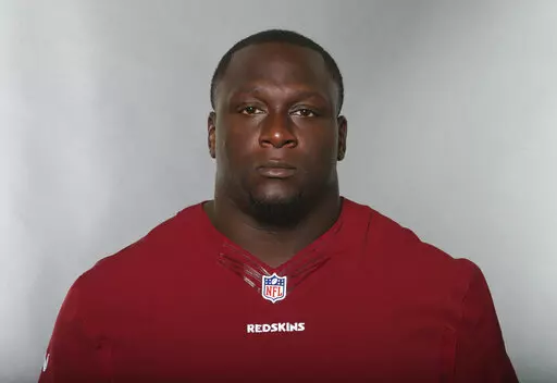 Jerrell Powe, of the Washington Redskins, poses for a photo in June 2016. Powe, a former University of Mississippi and NFL football player has been arrested in Mississippi on kidnapping charges. He remained jailed Monday, Jan. 16, 2023, in the Jackson, Miss., suburb of Ridgeland, Miss., with no bail set. It is unclear if he has a lawyer to speak for him. (AP Photo, File)