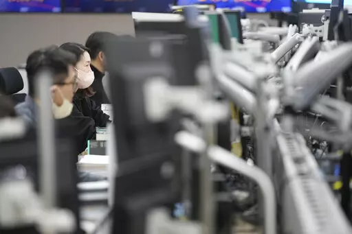 Currency traders watch computer monitors at a foreign exchange dealing room in Seoul, South Korea, Wednesday, Feb. 1, 2023. Asian stock markets were higher Wednesday after Wall Street rose ahead of what traders hope will be the last Federal Reserve interest rate hike for some time. (AP Photo/Lee Jin-man)