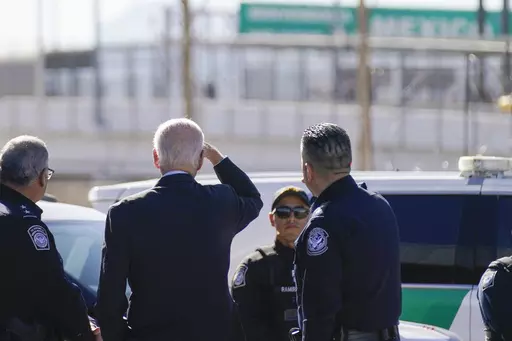 President Joe Biden, second from left, looks towards a large "Welcome to Mexico" sign that is hung over the Bridge of the Americas as he tours the El Paso port of entry, a busy port of entry along the U.S.-Mexico border, in El Paso Texas, Sunday, Jan. 8, 2023. (AP Photo/Andrew Harnik, File)