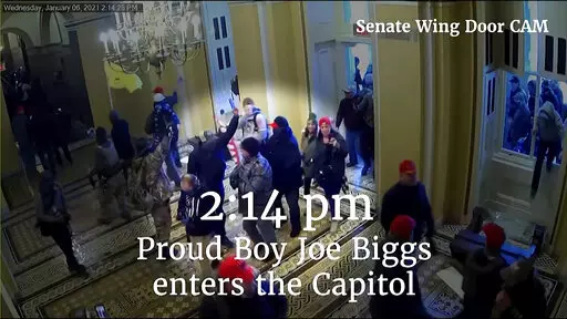 This image from video from a police worn body camera from the Jan. 6 riot at the U.S. Capitol, was played as a committee exhibit as the House select committee investigating the the Jan. 6 attack on the U.S. Capitol, held a hearing Thursday, June 9, 2022, on Capitol Hill in Washington. (House Select Committee via AP)