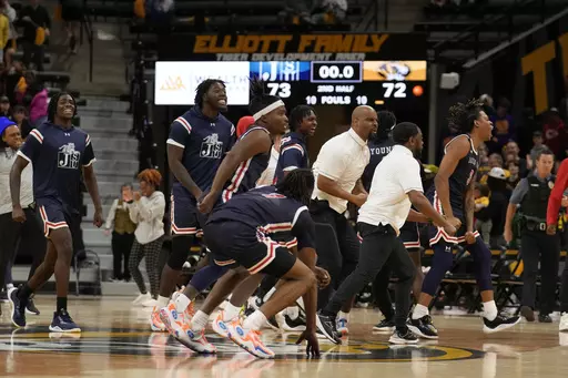 Members of Jackson State celebrate a 73-72 victory over Missouri following an NCAA college basketball game Sunday, Nov. 19, 2023, in Columbia, Mo. (AP Photo/Jeff Roberson)