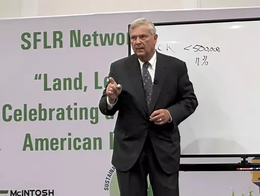 U.S. Agriculture Secretary Tom Vilsack speaks to a conference of Black forestland owners in Brunswick, Ga., on Tuesday, Aug. 22, 2023. Vilsack announced a new Biden administration program that will spend $150 million to help owners of small parcels of forestland partner with companies willing to pay them for carbon offsets and other environmental credits. (AP Photo/Russ Bynum)