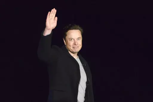 SpaceX's Elon Musk waves while providing an update on Starship, on Feb. 10, 2022, near Brownsville, Texas. Musk's Twitter has dissolved its Trust and Safety Council, the advisory group of around 100 independent civil, human rights and other organizations that the company formed in 2016 to address hate speech, child exploitation, suicide, self-harm and other problems on the platform. The council had been scheduled to meet with Twitter representatives Monday night, Dec. 12. But Twitter informed th