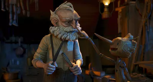 This image released by Netflix shows Gepetto, voiced by David Bradley, left, and Pinocchio, voiced by Gregory Mann, in a scene from "Guillermo del Toro's Pinocchio." (Netflix via AP)