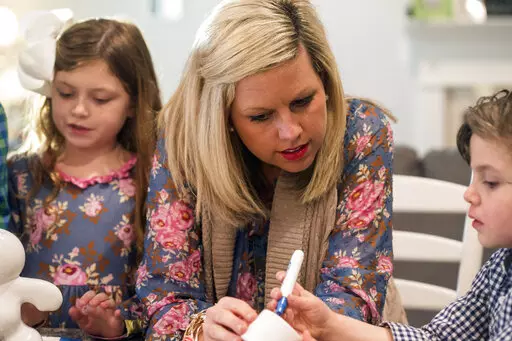 Bekah Bischoff plays Pictionary Man with her children, Henry and Ady, on Feb. 8, 2018 in Louisville, Ky. Bischoff, who developed preeclampsia during two pregnancies and now helps other moms who’ve had the condition, said she was diagnosed late in the third trimester both times. While pregnant with Henry in 2012, she found out she had a very severe type called HELLP Syndrome at 36 weeks. He was delivered that day. She nearly died. (Marty Pearl/Courier Journal via AP)