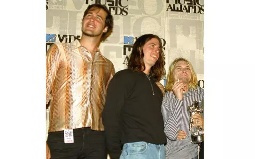 Nirvana band members, from left, Krist Novoselic, Dave Grohl and Kurt Cobain pose after receiving an award for best alternative video at the 10th annual MTV Video Music Awards in Universal City, Calif., on Sept. 2, 1993. A federal judge has dismissed the lawsuit of a 30-year-old man who alleged that the image of him nude as a baby on the 1991 cover of Nirvana’s “Nevermind" is child pornography. Judge Fernando Olguin granted the motion by Nirvana's attorneys to dismiss the case Monday, Jan. 3