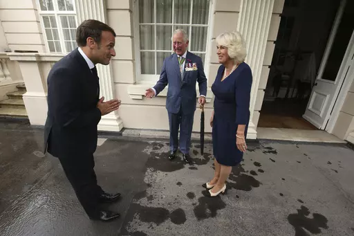 Britain's Prince Charles and Camilla, Duchess of Cornwall welcome French president Emmanuel Macron to Clarence House in London, Thursday June 18, 2020. Unrest in France is tarnishing the sheen of King Charles III’s first overseas trip as monarch. Striking workers have refused to provide red carpets and critics are calling for the British king's visit to be canceled altogether amid pension reform protests. (Jonathan Brady/Pool via AP, File)