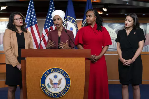 U.S. Rep. Ilhan Omar, D-Minn speaks, as U.S. Reps., from left, Rashida Tlaib, D-Mich., Ayanna Pressley, D-Mass., and Alexandria Ocasio-Cortez, D-N.Y., listen, during a news conference at the Capitol in Washington, July 15, 2019. A federal judge sentenced David George Hannon to three years of probation and a $7,000 fine for sending an email threatening to kill Omar and the three other congresswomen after the news conference. (AP Photo/J. Scott Applewhite, File)