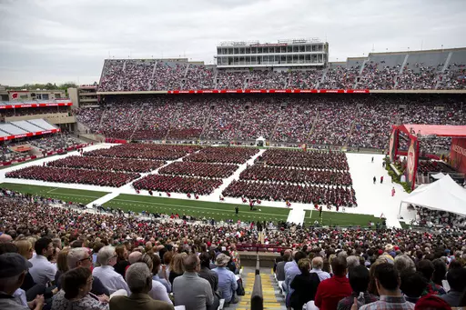 Attendees watch the 170th University of Wisconsin-Madison commencement ceremony at Camp Randall Stadium in Madison, Wis., on May 13, 2023. Republican lawmakers were poised Tuesday, June 13, to cut funding for University of Wisconsin campuses as the GOP-controlled state Legislature and school officials continue to clash over efforts to promote diversity and inclusion. (Samantha Madar/Wisconsin State Journal via AP, File)