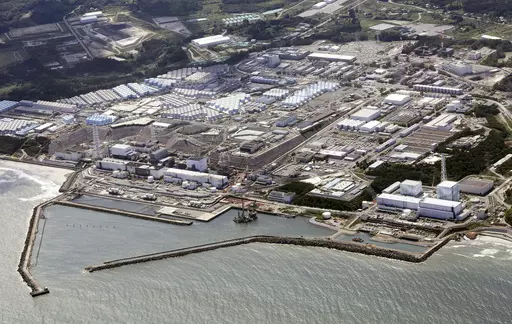 This aerial view shows the wrecked Fukushima Daiichi nuclear power plant in Okuma town, northeastern Japan, on Aug. 24, 2023. A drone small enough to fit in one's hand flew inside one of the damaged reactors at the wrecked nuclear power plant Wednesday, Feb. 28, 2024, in hopes it can examine some of the molten fuel debris in areas where earlier robots failed to reach. (Kyodo News via AP, File)