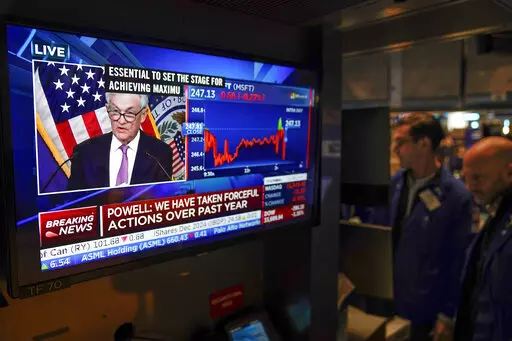Traders on the floor at the New York Stock Exchange watch Federal Reserve Chair Jerome Powell's news conference after the Federal Reserve interest rate announcement in New York, Wednesday, Feb. 1, 2023. (AP Photo/Seth Wenig)
