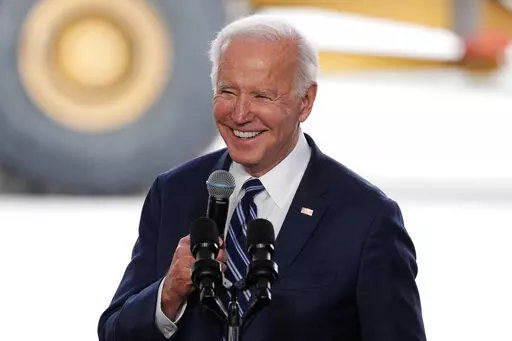 President Joe Biden smiles as he speaks after touring the Taiwan Semiconductor Manufacturing Company facility under construction in Phoenix, on Dec. 6, 2022. Biden is facing consistent but critical assessments of his leadership and the national economy as his second year in the White House comes to a close. A new poll from The Associated Press-NORC Center for Public Affairs Research finds 43% of U.S. adults say they approve of the way Biden is handling his job as president, while 55% disapprove.