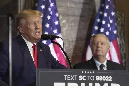 Former President Donald Trump, left, speaks at a campaign event as Sen. Lindsey Graham, R-S.C., looks on Jan. 28, 2023, in Columbia, S.C. The long and occasionally quixotic relationship between Trump and Graham has turned negative once more after the South Carolina senator criticized Trump's refusal to support a federal abortion ban. (AP Photo/Meg Kinnard, File)