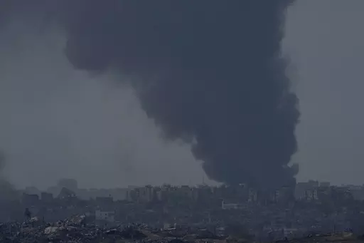 Smoke rises following an Israeli bombardment in the Gaza Strip, as seen from southern Israel,, Friday, Dec. 8, 2023. (AP Photo/Maya Alleruzzo)