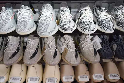 Yeezy shoes made by Adidas are displayed at Laced Up, a sneaker resale store, in Paramus, N.J., on Oct. 25, 2022. Adidas is releasing a second batch of high-end Yeezy sneakers after cutting ties with rapper Ye, formerly known as Kanye West, as the shoemaker seeks to unload the unsold shoes while donating to groups fighting antisemitism. The online sale, to start Wednesday Aug. 2, 2023 through the Confirmed app, Adidas app and adidas.com, follows an earlier batch of sales in May. (AP Photo/Seth W