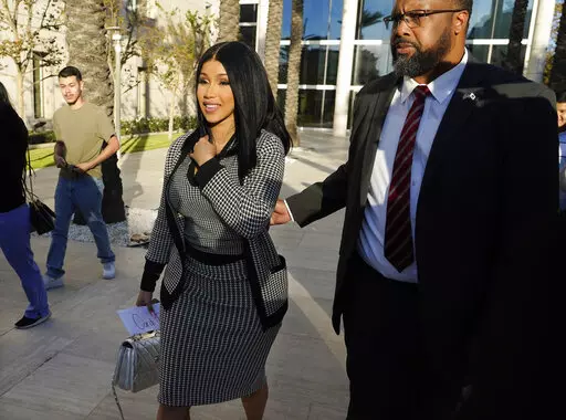 Cardi B exits federal court as proceedings continue in a $5 million copyright infringement lawsuit against her in federal court, Wednesday, Oct. 19, 2022, in Santa Ana, Calif. Kevin Michael Brophy is suing the Grammy-winning musician for allegedly misusing his likeness for her sexually suggestive mixtape cover art in 2016. (AP Photo/Chris Pizzello)