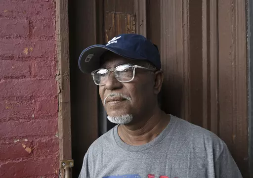 Former pizza shop owner Mohammed Hossain, who was arrested by federal authorities in 2004 as part of a counter-terrorism sting and sentenced to 15 years in jail, talks about his time in prison and the rehabbing work he is doing on his rental property, Monday, July 31, 2023, in Albany, N.Y. Hossain and Yassin Aref were arrested as part of a fictitious plot to launder money from the sale of a shoulder-fired missile. Convicted in 2006, both men are out of prison and maintain their innocence. (AP Ph
