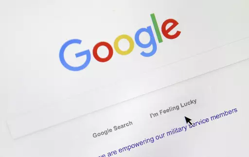 A cursor moves over Google's search engine page, Aug. 28, 2018, in Portland, Ore. Good news for all the password-haters out there: Google has taken a big step toward making them an afterthought by adding “passkeys” as a more straightforward and secure way to log into its services. (AP Photo/Don Ryan, File)