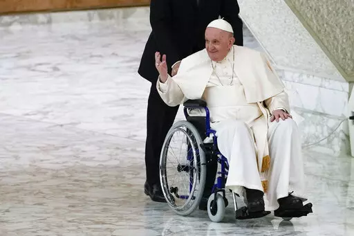 Pope Francis arrives in a wheelchair to attend an audience with nuns and religious superiors in the Paul VI Hall at The Vatican, Thursday, May 5, 2022. Pope Francis, whose mobility has been limited of late by a nagging knee problem, is looking forward to visiting South Sudan in July, according to a joint message by the pontiff, the archbishop of Canterbury and a Scottish church official. (AP Photo/Alessandra Tarantino, File)