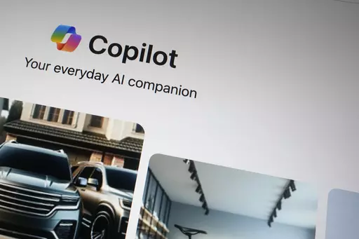 A Copilot page showing the incorporation of AI technology is shown in London, Tuesday, Feb. 13, 2024. A Microsoft engineer is sounding an alarm Wednesday, March 6, 2024, about offensive and harmful imagery he says is too easily made by the company’s artificial intelligence image-generator tool. (AP Photo/Alastair Grant, File)