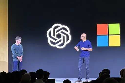 OpenAI CEO Sam Altman, left, appears onstage with Microsoft CEO Satya Nadella at OpenAI's first developer conference, on Nov. 6, 2023, in San Francisco. Microsoft has quit its seat on the board of OpenAI, saying its role is no longer needed because the ChatGPT maker has improved its governance since being roiled by boardroom chaos last year. In a letter sent on Tuesday, July 9, 2024, Microsoft confirmed it was resigning, “effective immediately,” from its role as an observer on the board. (AP