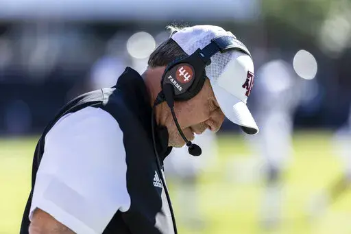Texas A&M head coach Jimbo Fisher looks down between plays during an NCAA football game against Mississippi State, Saturday, Oct. 1, 2022, in Starkville, Miss. Texas A&M was selected most disappointing team in the Associated Press SEC Midseason Awards, Wednesday, Oct. 12, 2022. (AP Photo/Vasha Hunt, File)