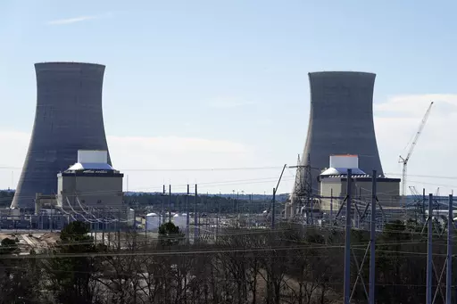 Units 3, left, and 4 and their cooling towers stand at Georgia Power Co.'s Plant Vogtle nuclear power plant, Jan. 20, 2023, in Waynesboro, Ga. Federal nuclear regulators announced on Friday, July 28, that they had cleared Georgia Power and its co-owners to load radioactive fuel into Unit 4, shown at right, the second of two new reactors on the site. (AP Photo/John Bazemore, File)