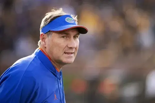 Florida head coach Dan Mullen watches his team perform during the first quarter of an NCAA college football game against Missouri Saturday, Nov. 20, 2021, in Columbia, Mo. (AP Photo/L.G. Patterson, File)