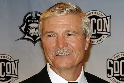 Carl Torbush poses after being introduced as the NCAA college football head coach at East Tennessee State, Friday, June 21, 2013, in Johnson City, Tenn. Torbush, a defensive specialist who succeeded Mack Brown as North Carolina's head football coach after Brown’s first tenure and later coached at East Tennessee State, has died. He was 72. ETSU said Monday that Torbush died Sunday, Nov. 5, 2023. (David Boyd/The Johnson City Press via AP, File)