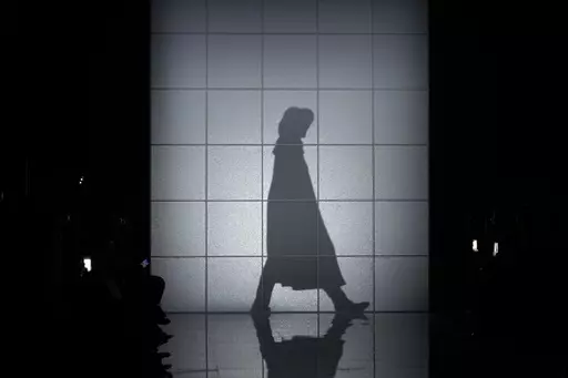 A model wears a creation as part of the Giorgio Armani women's Fall-Winter 2024-25 collection presented in Milan, Italy, Sunday, Feb. 25, 2024. (AP Photo/Luca Bruno)