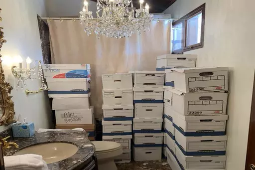 This image, contained in the indictment against former President Donald Trump, shows boxes of records stored in a bathroom and shower in the Lake Room at Trump's Mar-a-Lago estate in Palm Beach, Fla. The classified documents investigation of Donald Trump appeared to have clear momentum in 2022 when FBI agents who searched the former president’s Mar-a-Lago estate recovered dozens of boxes containing sensitive documents. But each passing day brings mounting doubts that the case can reach trial t